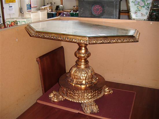 Gilt carved wood marble topped octagonal table(-)